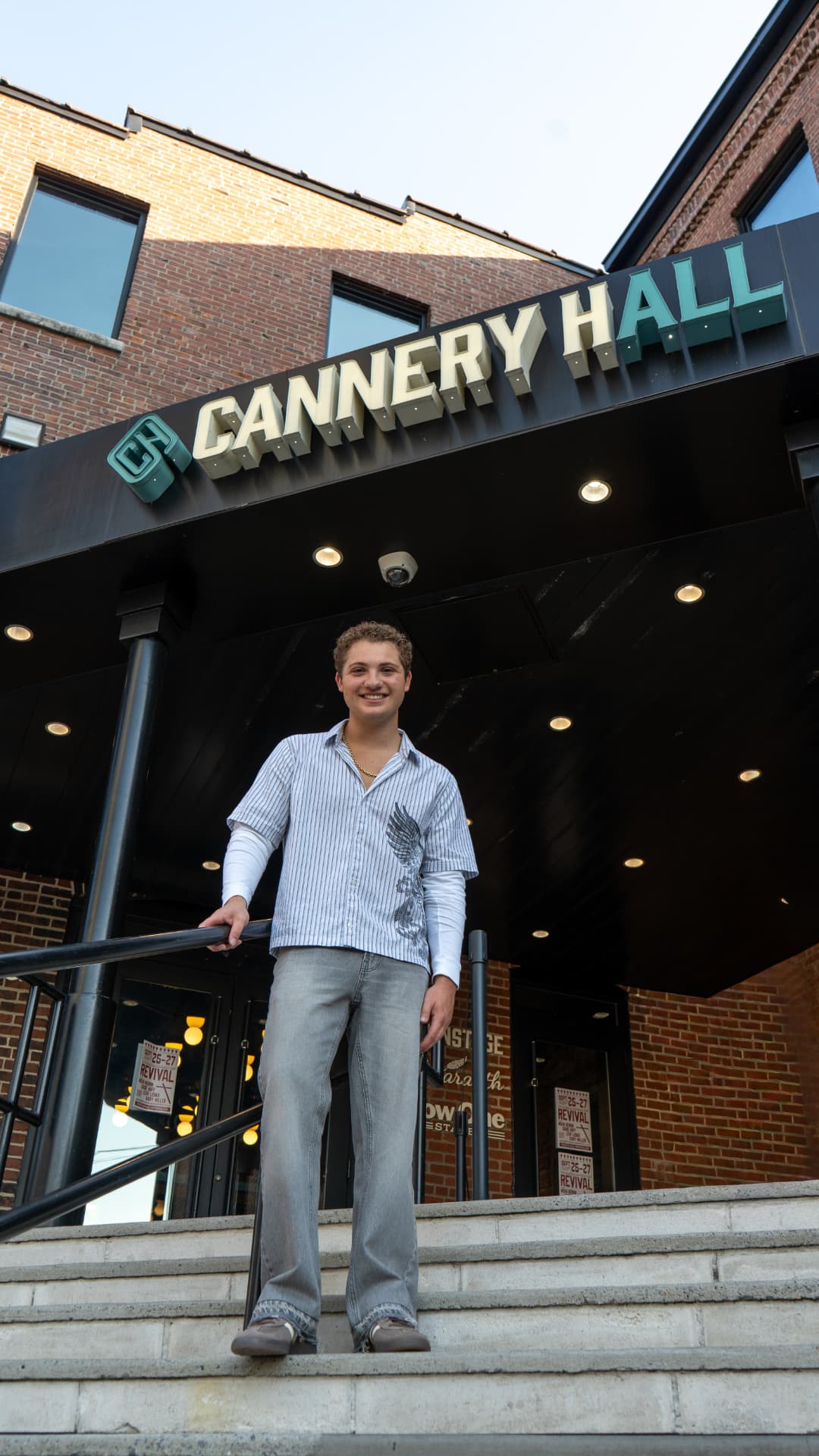 Davey J on the steps in front of the Cannery Hall marquee